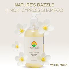 Nature's Dazzle Hinoki Cypress Shampoo bottle with white flowers on a light beige background