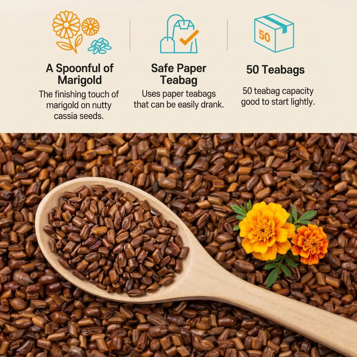 Roasted cassia seeds (gyeolmyeongja) on a wooden spoon with fresh marigold flowers — close-up detail