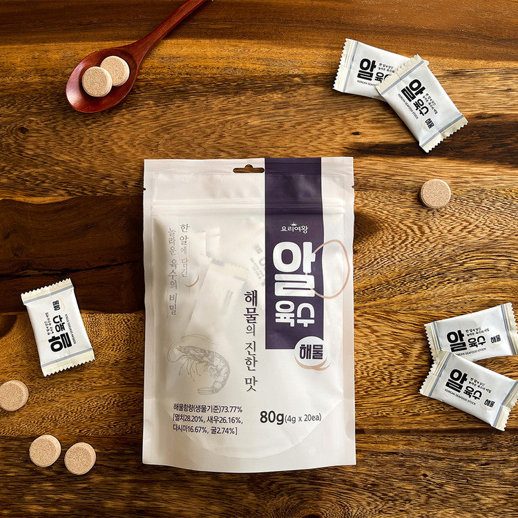 Kosbee Korean seafood soup stock coin, 80g, showing small fish and seafood ingredients in a clear broth package.
