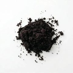 Close-up texture of fine, dark purple Herb & Honey Acai Berry Powder on a clean white background.