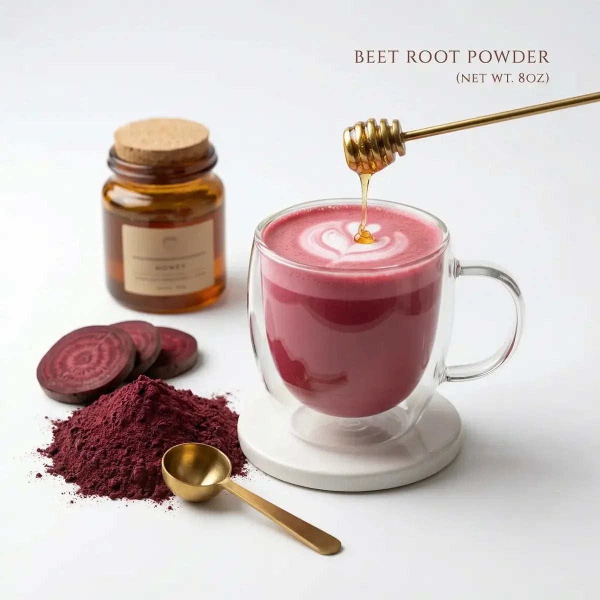 Beet root powder latte in a glass, ruby pink color