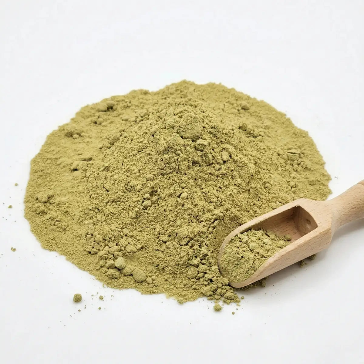A close-up of vibrant green Herb & Honey 100% Pure Korean Bitter Melon Powder with a small wooden scoop on a white background.