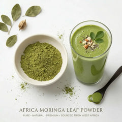 A refreshing glass of green smoothie and a bowl of Herb & Honey Africa Moringa Leaf Powder with fresh moringa leaves on a white background.