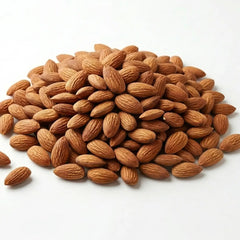 A pile of premium Herb & Honey raw almonds on a white background, 100% US-grown and unroasted.