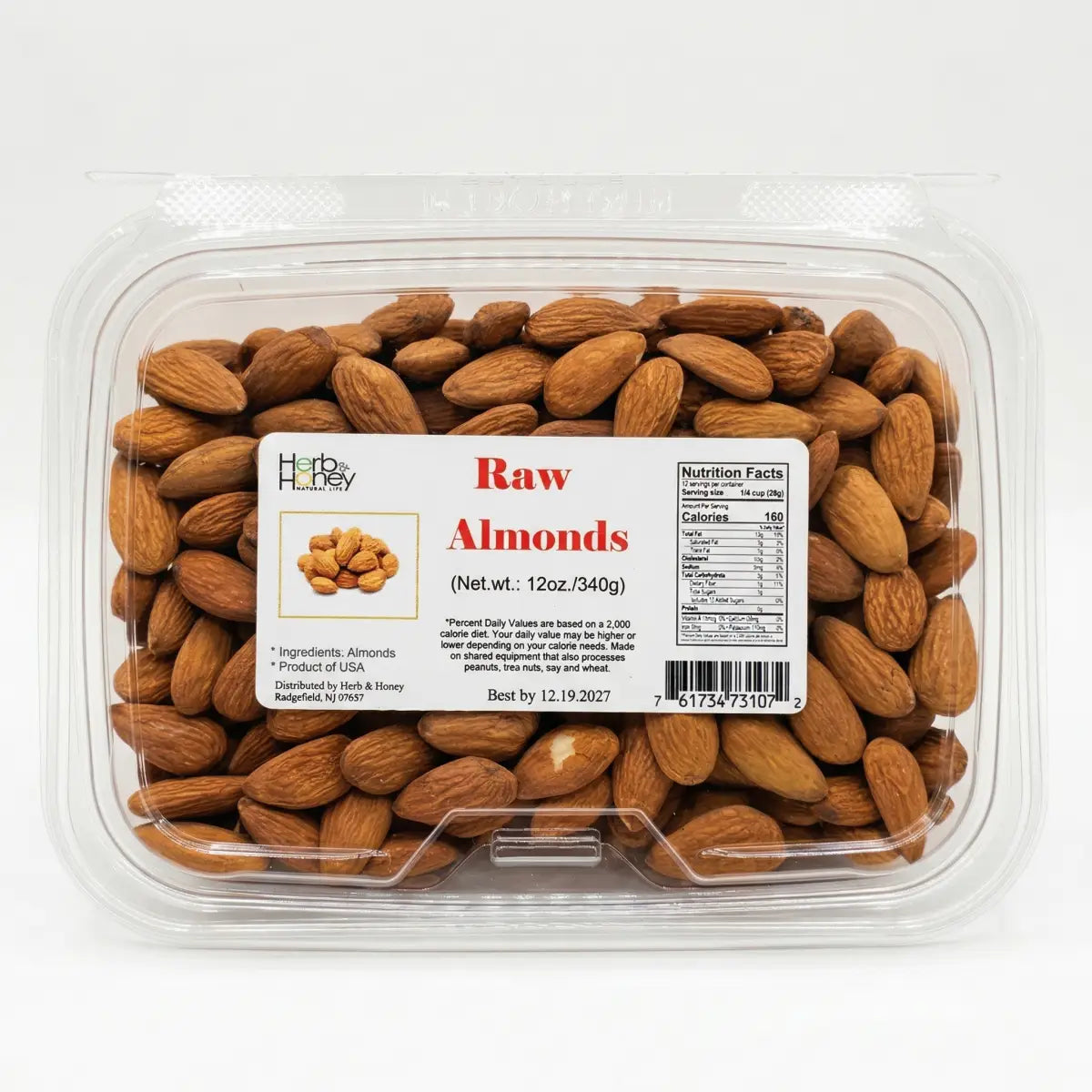 A clear container of Herb & Honey Raw Almonds, 12oz, featuring 100% US-grown unroasted almonds.