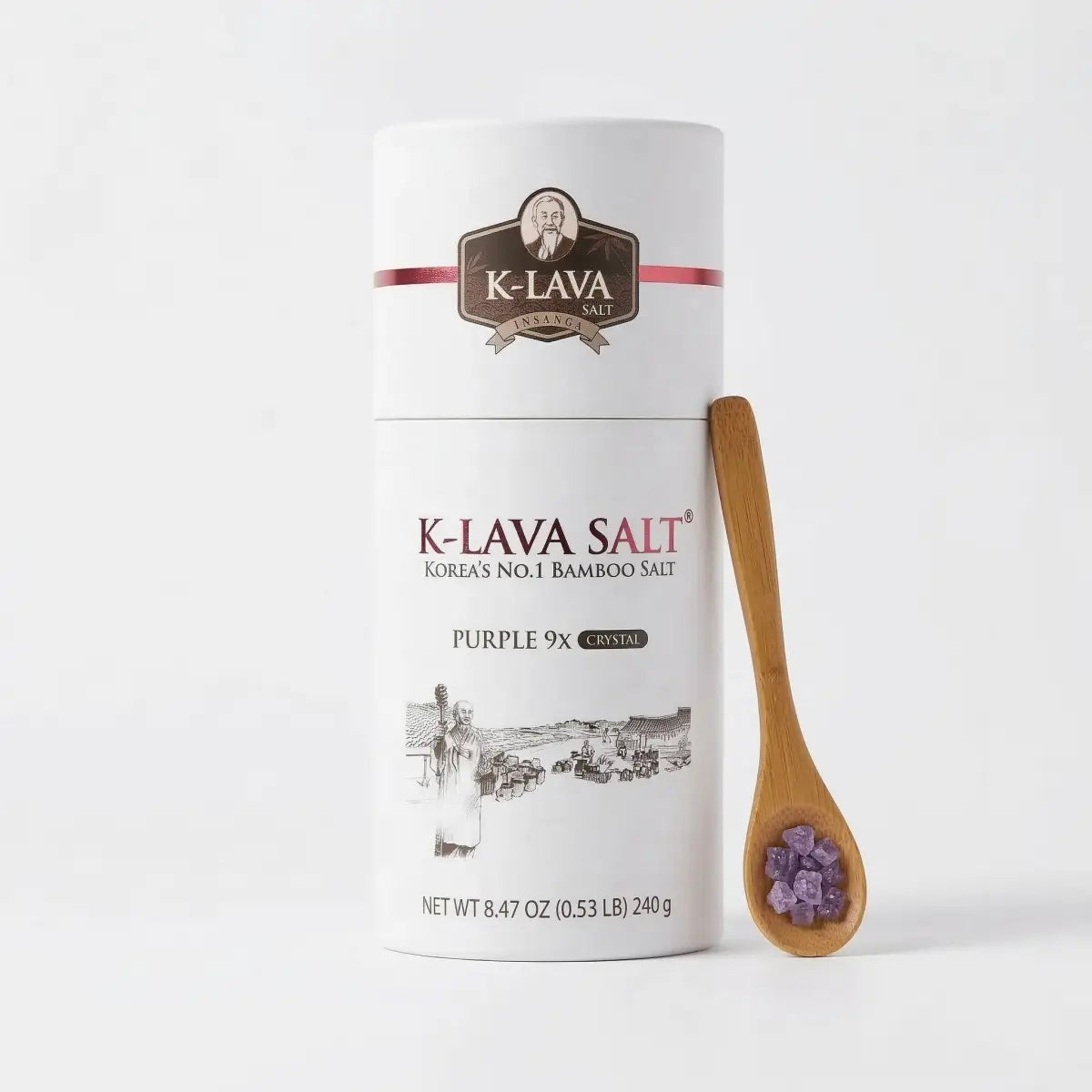 K-Lava Purple 9x Roasted Korean Bamboo Salt Crystals (8.47 oz) in a premium canister with a wooden spoon, showcasing rich mineral texture.