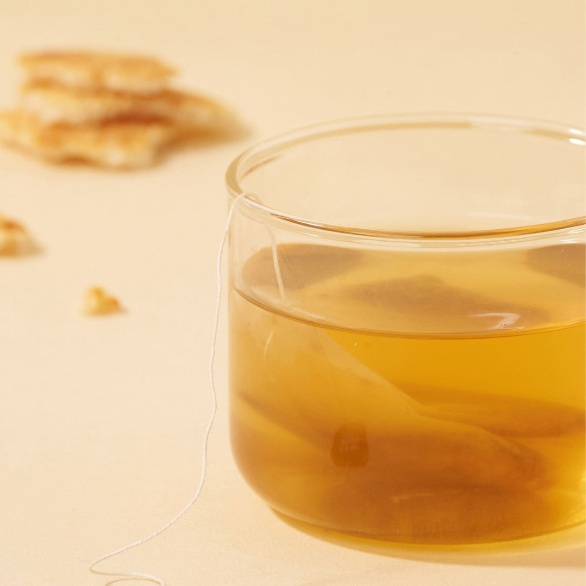 Hot & Cool tea bag steeping in a glass of golden Korean nurungji Solomon's seal tea