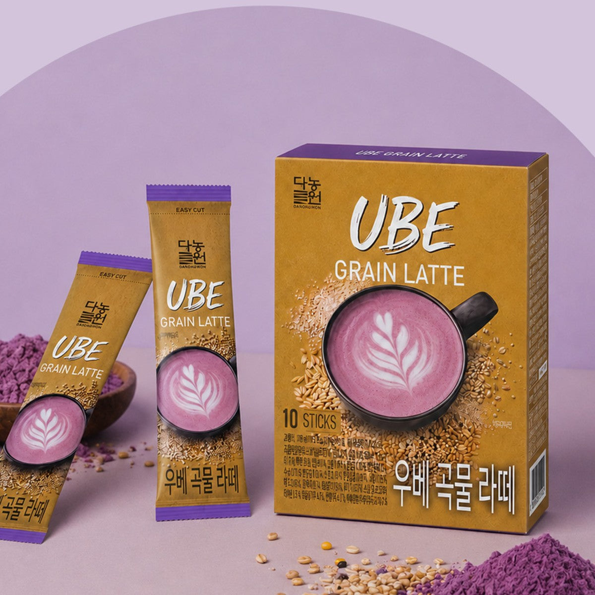 Korean ube grain latte box and two sticks with purple ube powder and mixed grains