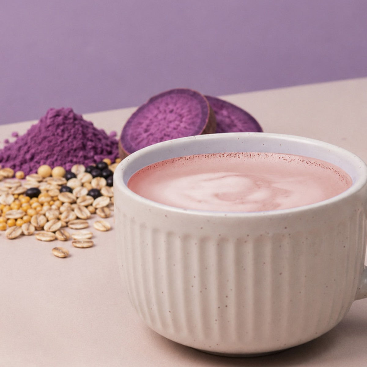 Hot Korean ube grain latte in a white mug with ube powder, purple yam and mixed grains
