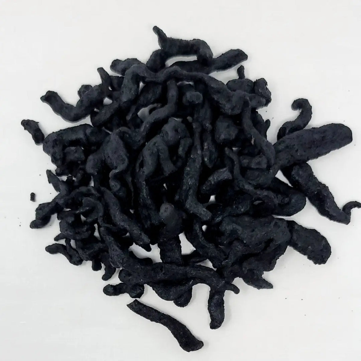 Detailed view of sliced and steamed Rehmannia root also known as Shu Di Huang for natural herbal remedies