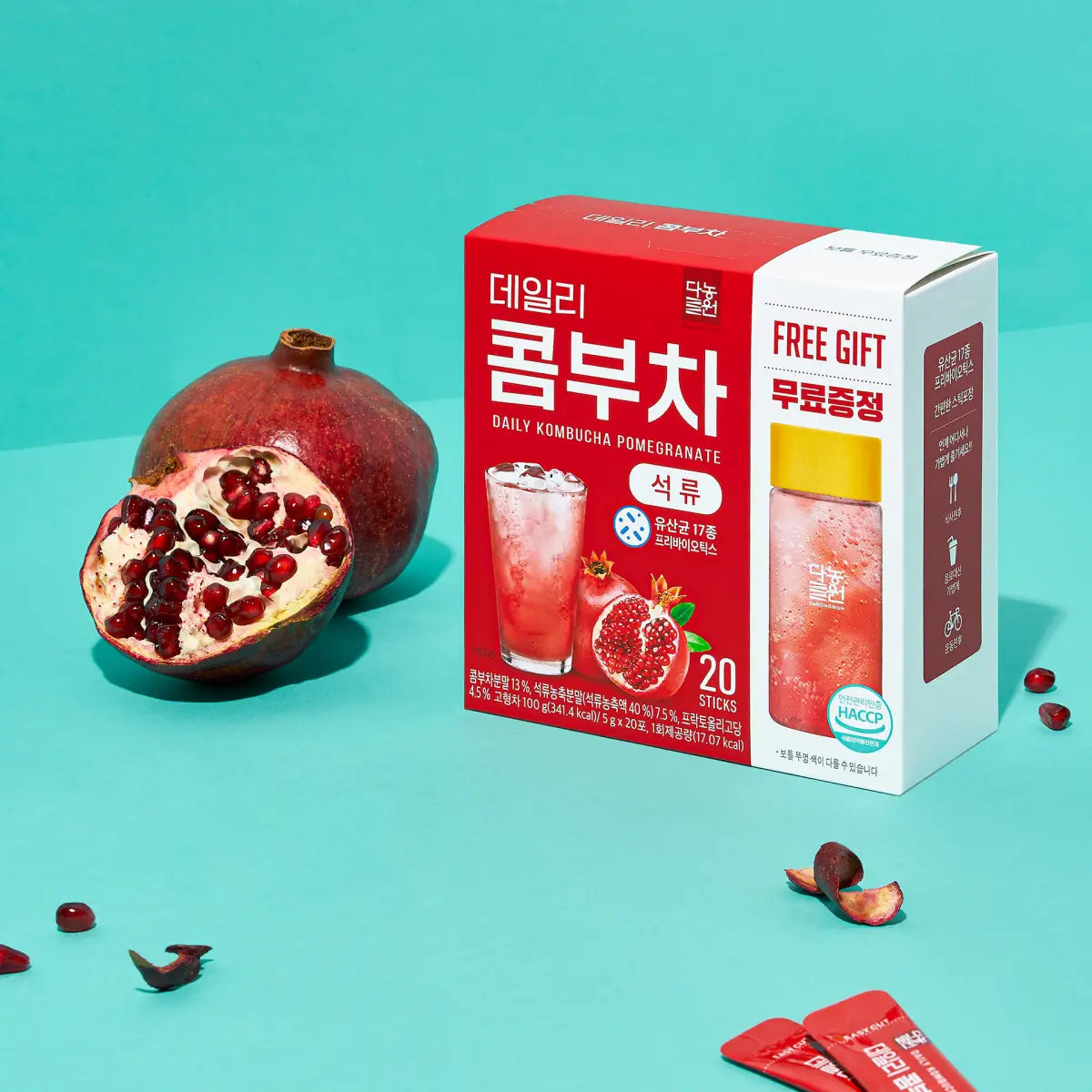 Danongwon Daily Kombucha Pomegranate tea powder sticks, sugar-free, with pomegranate flavor, displayed in a close-up image.