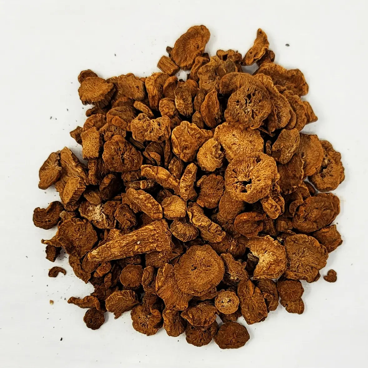 Detailed close-up of earthy roasted Korean burdock root slices for brewing natural wellness tea