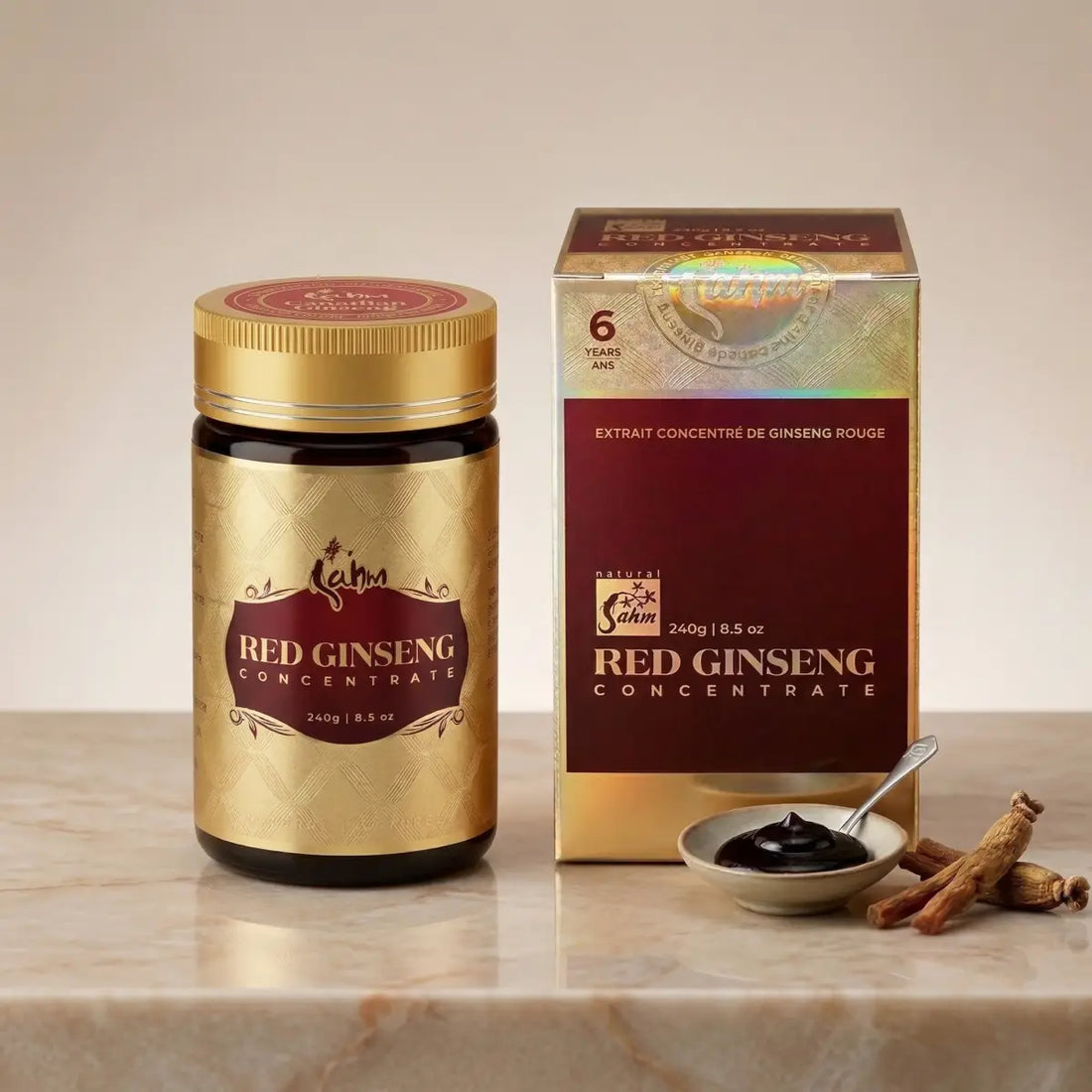 Sahm Canadian Red Ginseng Concentrate 240g jar and gold packaging box with a spoon of dark ginseng extract and dried roots on a marble surface.