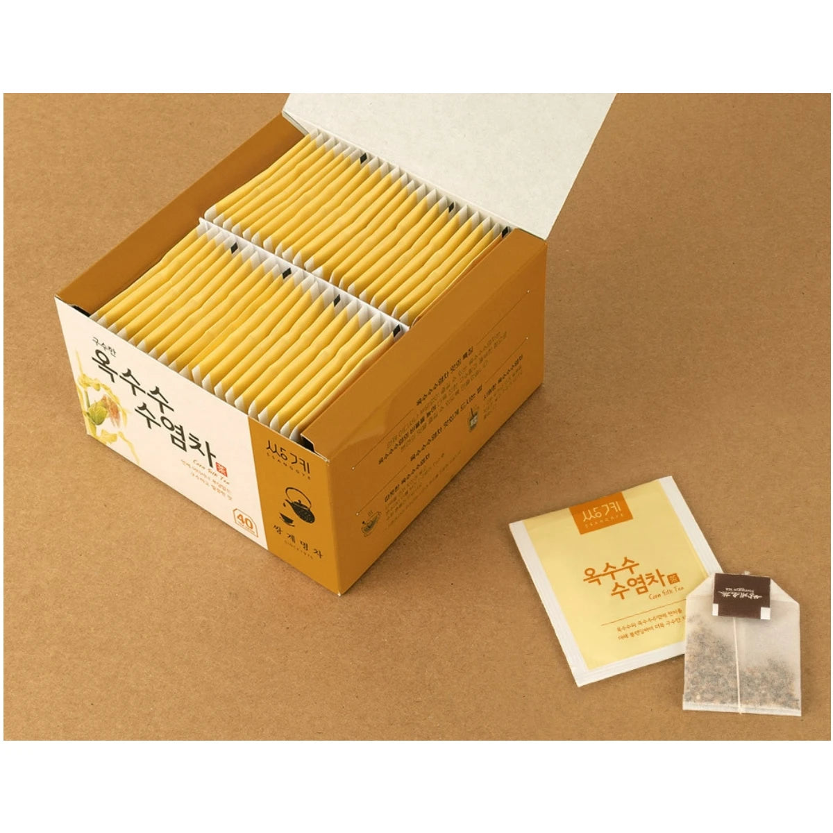Smart dispenser box design for Ssanggye Roasted Corn Silk Tea, showing how to easily pull a single teabag from the bottom for everyday convenience.
