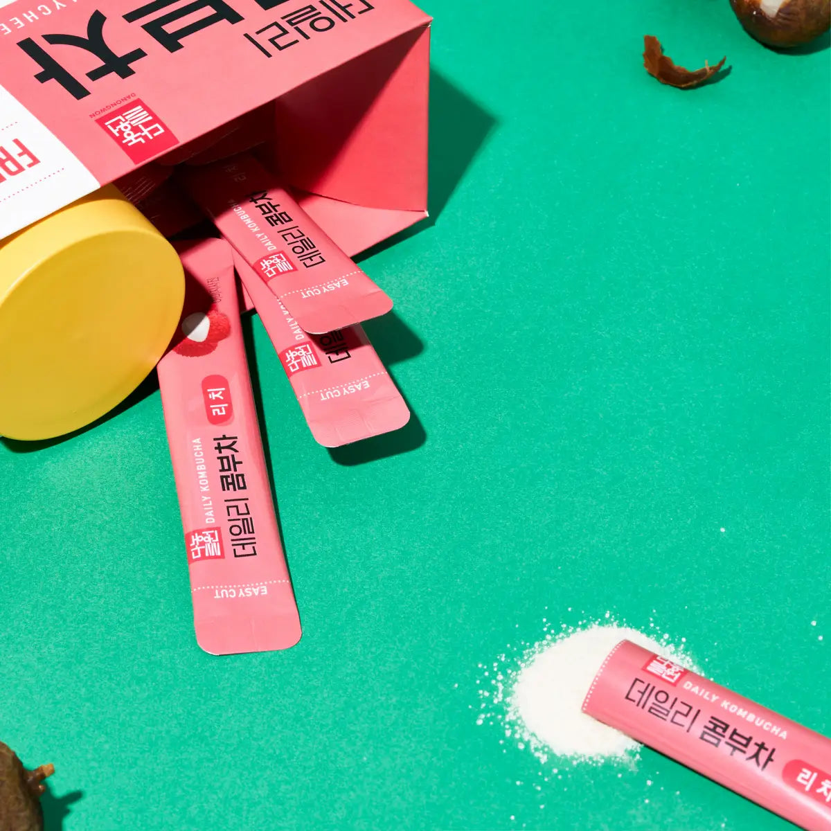 Danongwon Daily Kombucha Lychee Tea sticks on the go, sugar-free lychee flavor, includes free bottle for convenient drinking.